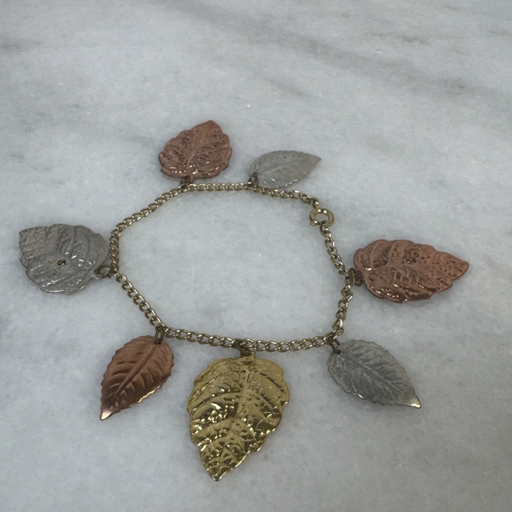 Gold tone bronze, gold silver leaf charm bracelet   7"